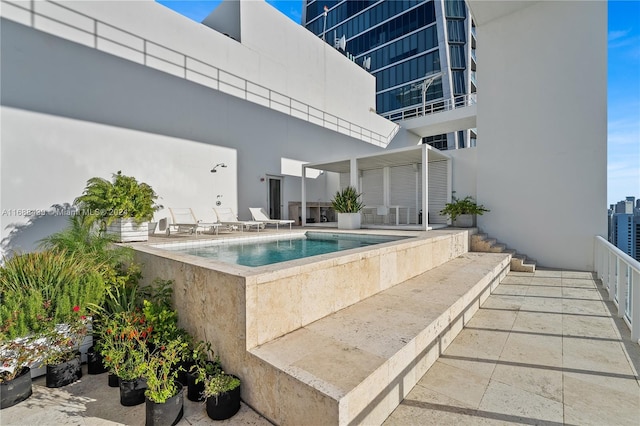 view of pool featuring a patio