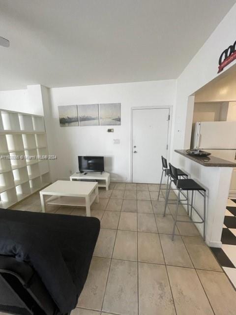 1200 Euclid Ave Unit 109, Miami Beach, FL 33139 - living area featuring light tile patterned floors