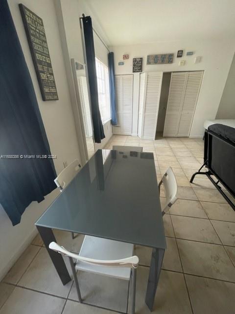 1200 Euclid Ave Unit 109, Miami Beach, FL 33139 - dining space featuring light tile patterned flooring