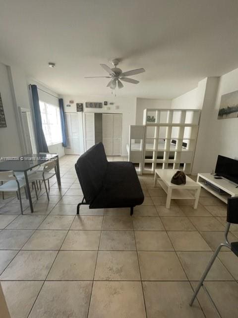 1200 Euclid Ave Unit 109, Miami Beach, FL 33139 - living room featuring light tile patterned floors and a ceiling fan