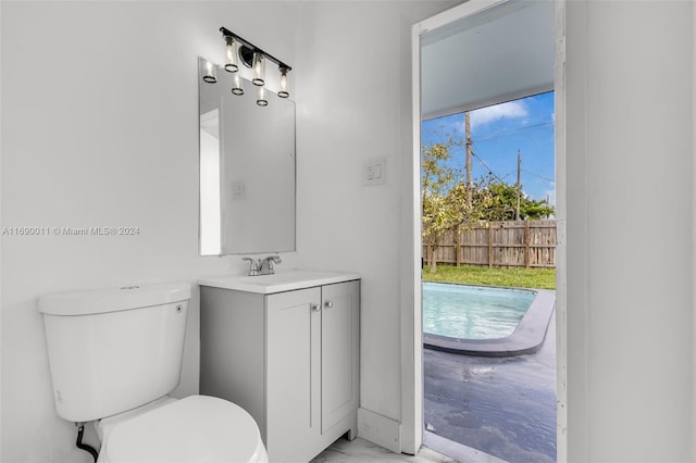 bathroom with toilet and vanity