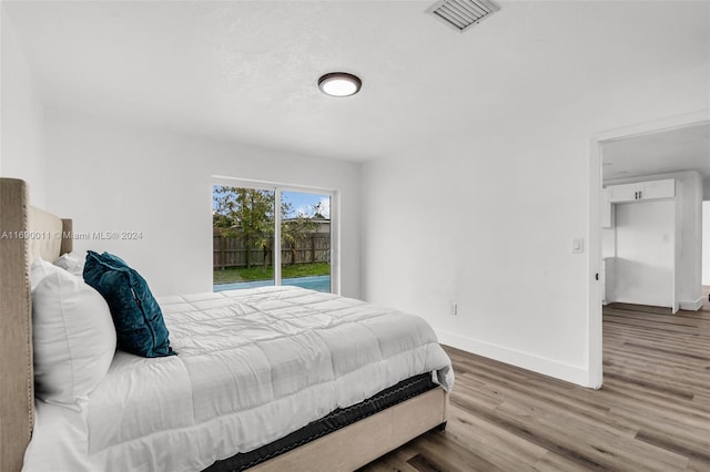 bedroom with hardwood / wood-style flooring