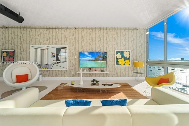 living area with wallpapered walls