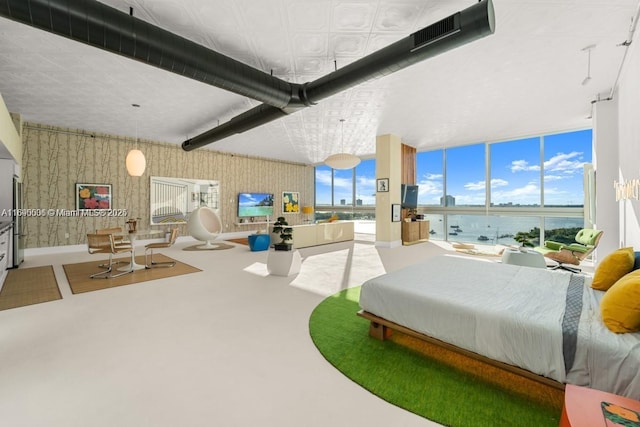 bedroom with visible vents, wallpapered walls, and carpet floors