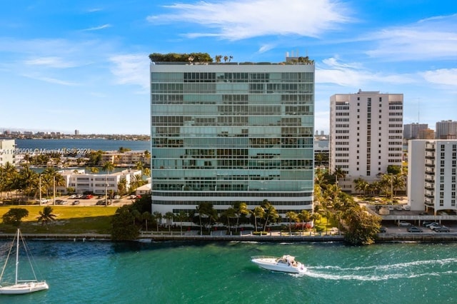 exterior space featuring a water view and a city view