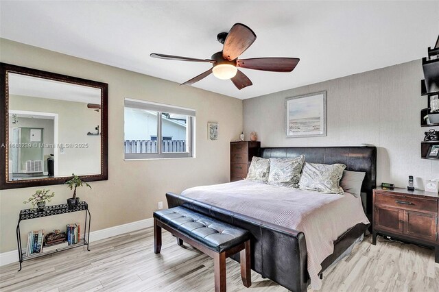 bedroom featuring light wood-type flooring and ceiling fan