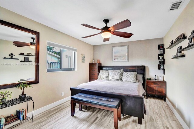 bedroom with ceiling fan and light hardwood / wood-style flooring