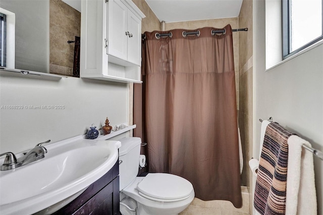 bathroom featuring vanity, toilet, and a shower with curtain