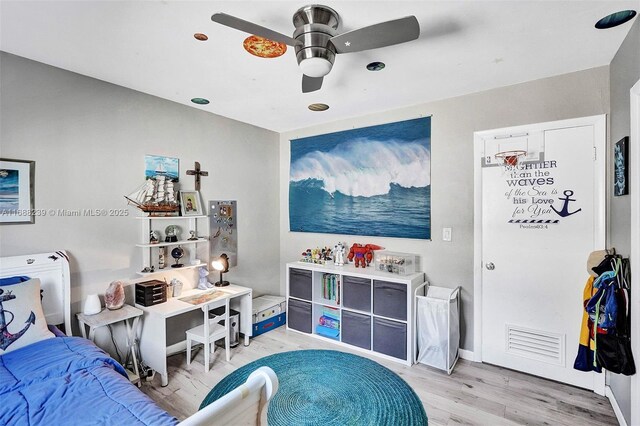 bedroom featuring wood-type flooring and ceiling fan