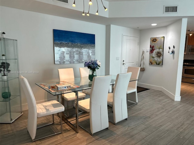 dining room with hardwood / wood-style floors