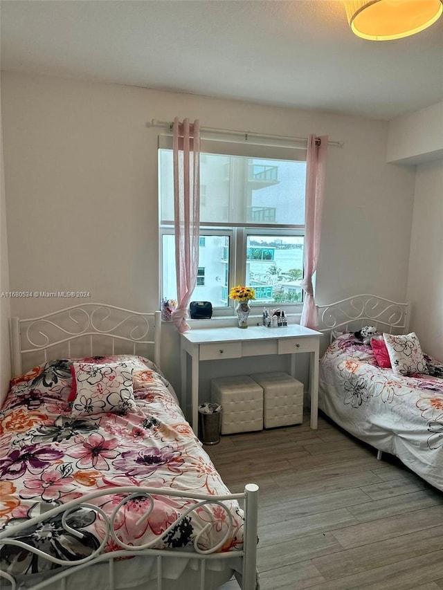 bedroom with hardwood / wood-style flooring