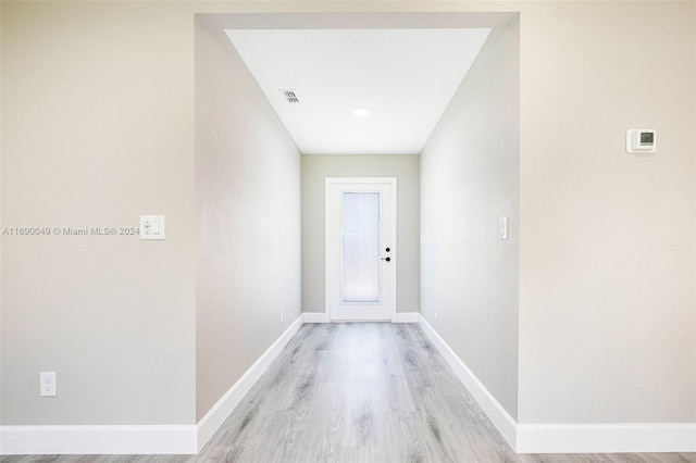 hall with light hardwood / wood-style floors