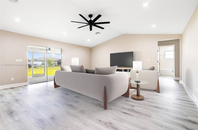 living room featuring light hardwood / wood-style floors, ceiling fan, and vaulted ceiling