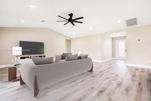 living room with light wood-type flooring, ceiling fan, and vaulted ceiling