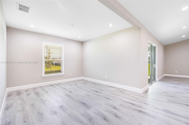 spare room with light wood-type flooring