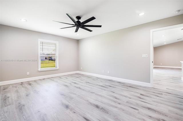 spare room featuring light hardwood / wood-style floors and ceiling fan