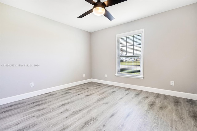 unfurnished room with light wood-type flooring and ceiling fan