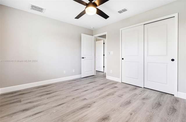 unfurnished bedroom featuring a closet, ceiling fan, and light hardwood / wood-style flooring