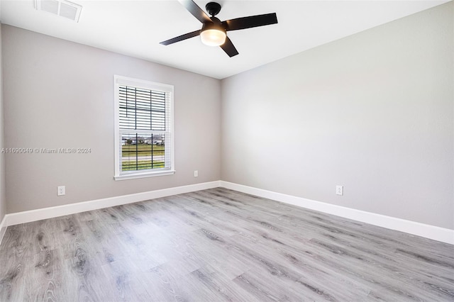 empty room with light wood-type flooring and ceiling fan