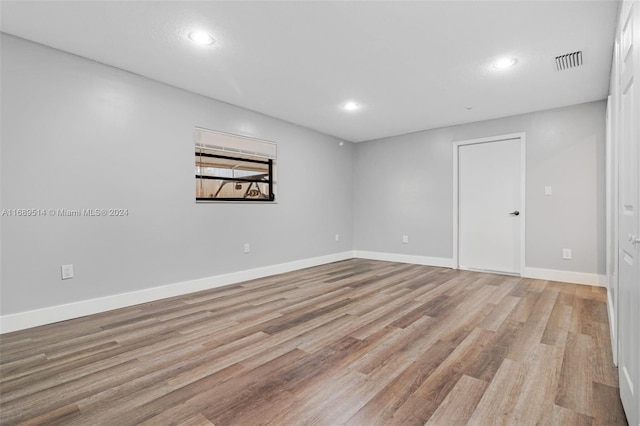 spare room featuring light wood-type flooring