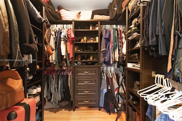 spacious closet with light hardwood / wood-style floors