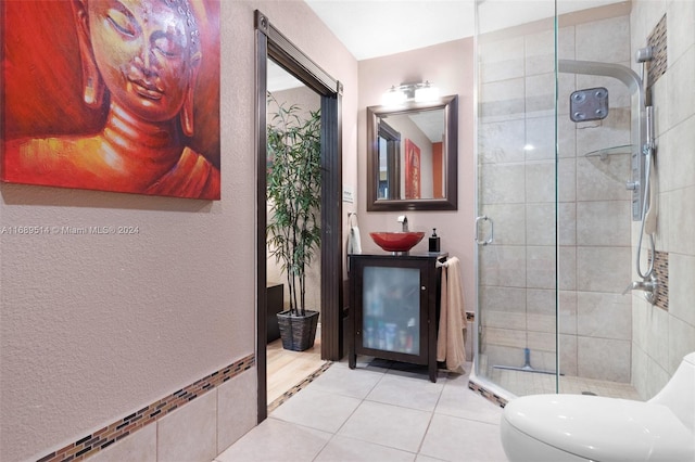 bathroom with toilet, an enclosed shower, vanity, and tile patterned floors