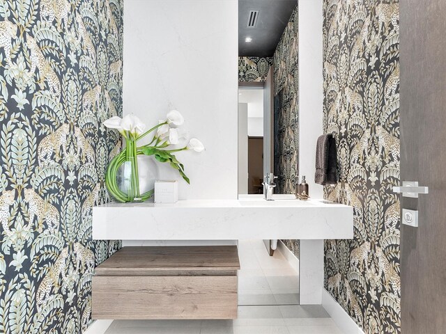 bathroom with tile patterned floors