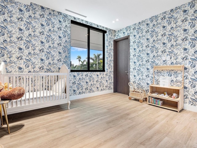 bedroom with hardwood / wood-style floors