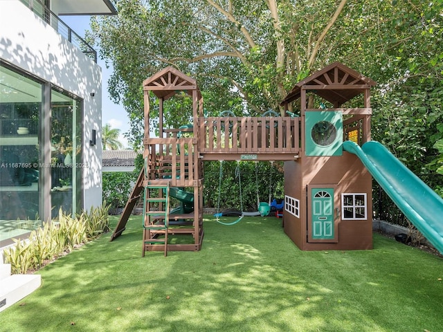 view of playground featuring a lawn