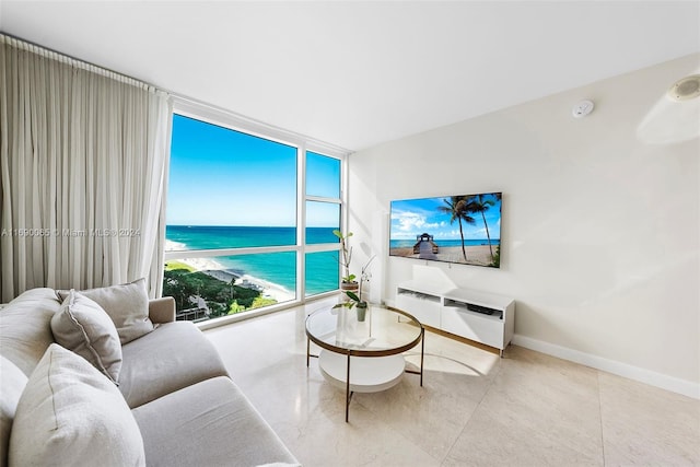 6801 Collins Ave Unit 1215, Miami Beach, FL 33141 - tiled living room featuring baseboards and floor to ceiling windows