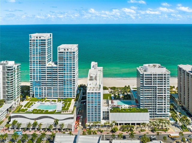 bird's eye view featuring a beach view and a water view