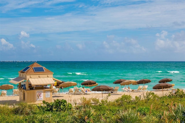 property view of water featuring a beach view