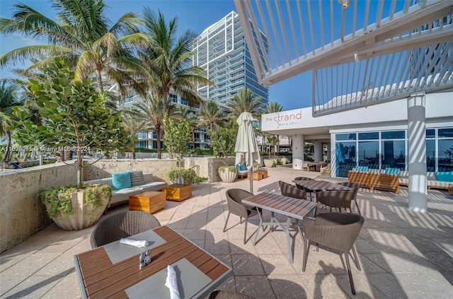 6801 Collins Ave Unit 1215, Miami Beach, FL 33141 - view of patio with outdoor dining space and an outdoor living space