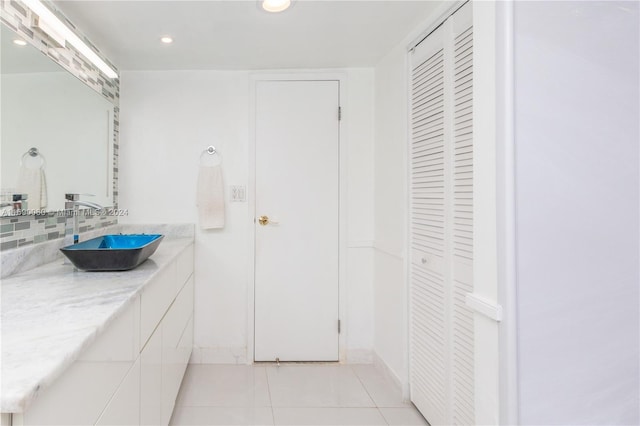 bathroom with vanity and tile patterned flooring