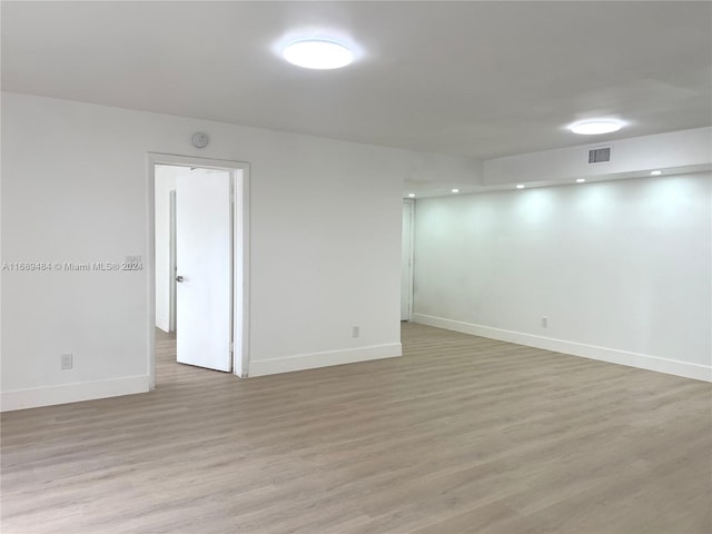 spare room with light wood-type flooring