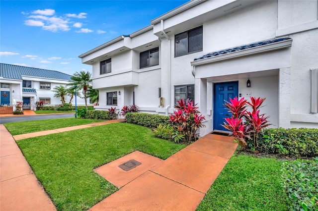 view of front of house with a front lawn