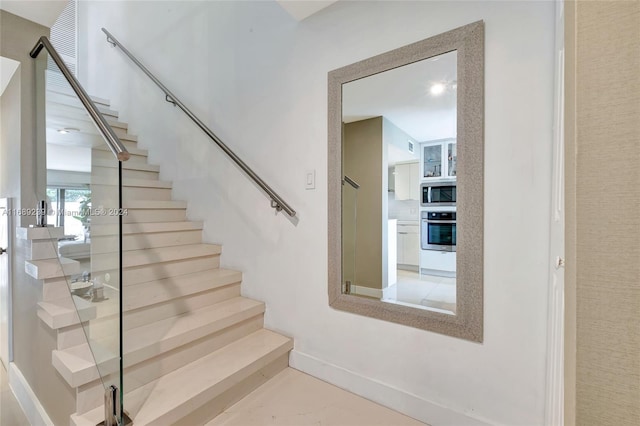 21300 San Simeon Way Unit K2, Miami, FL 33179 - stairs featuring baseboards