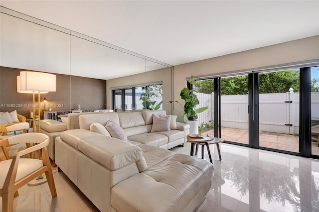 living room featuring a healthy amount of sunlight and french doors