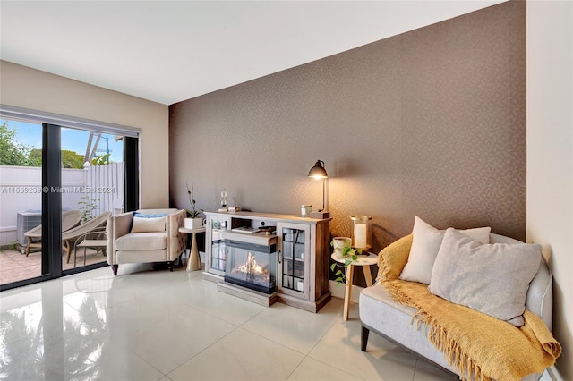 living area with tile patterned floors