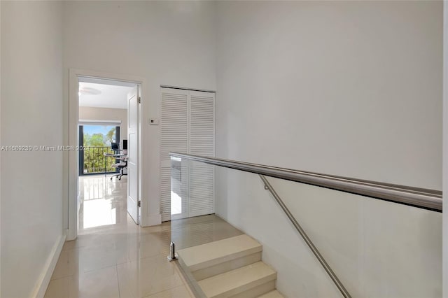 21300 San Simeon Way Unit K2, Miami, FL 33179 - stairway featuring baseboards and tile patterned floors