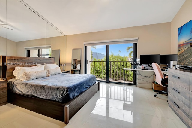 21300 San Simeon Way Unit K2, Miami, FL 33179 - bedroom with access to outside, a desk, and light tile patterned floors