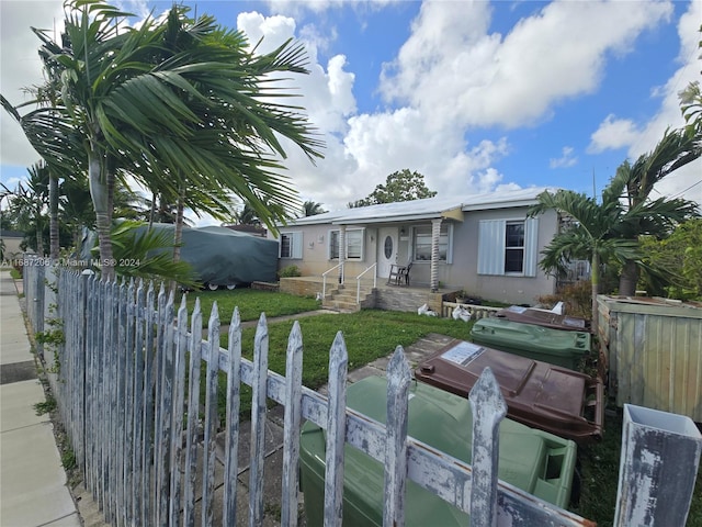 view of front of home with a front yard