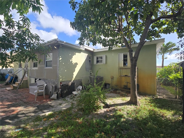 back of house with a patio area