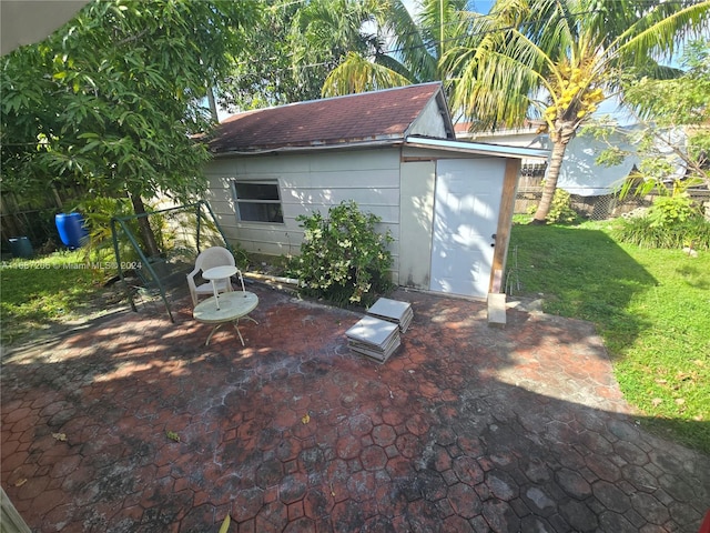 view of patio featuring a storage shed