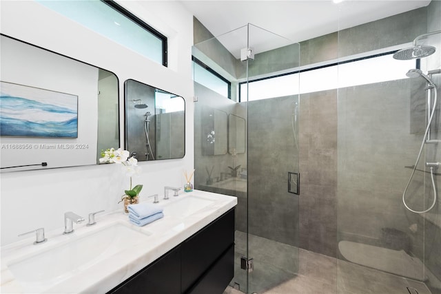 bathroom with an enclosed shower and vanity