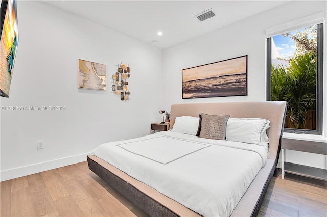 bedroom with light hardwood / wood-style floors