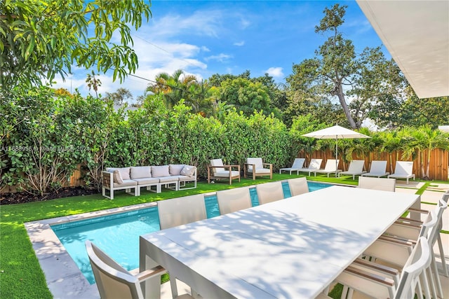 view of pool featuring a patio area, a lawn, and an outdoor hangout area