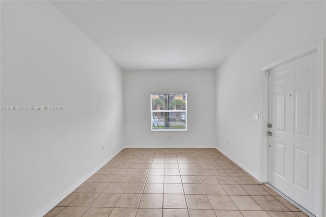 empty room with light tile patterned flooring