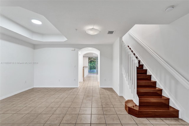 staircase featuring tile patterned floors