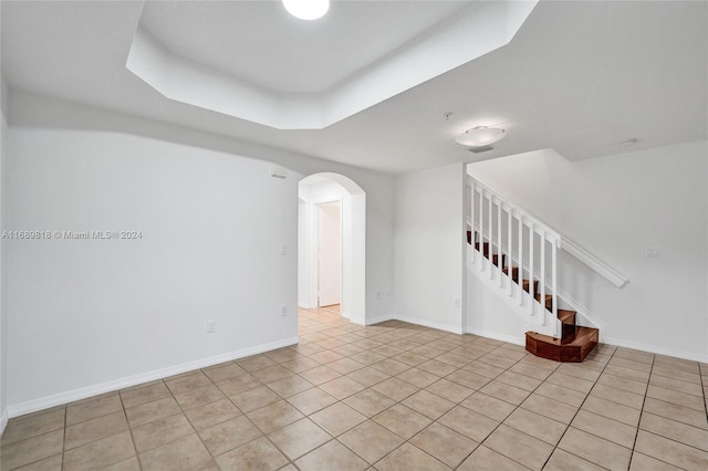 empty room with light tile patterned flooring